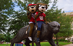 Southpaw and Miss Pawla sitting on the jag statue